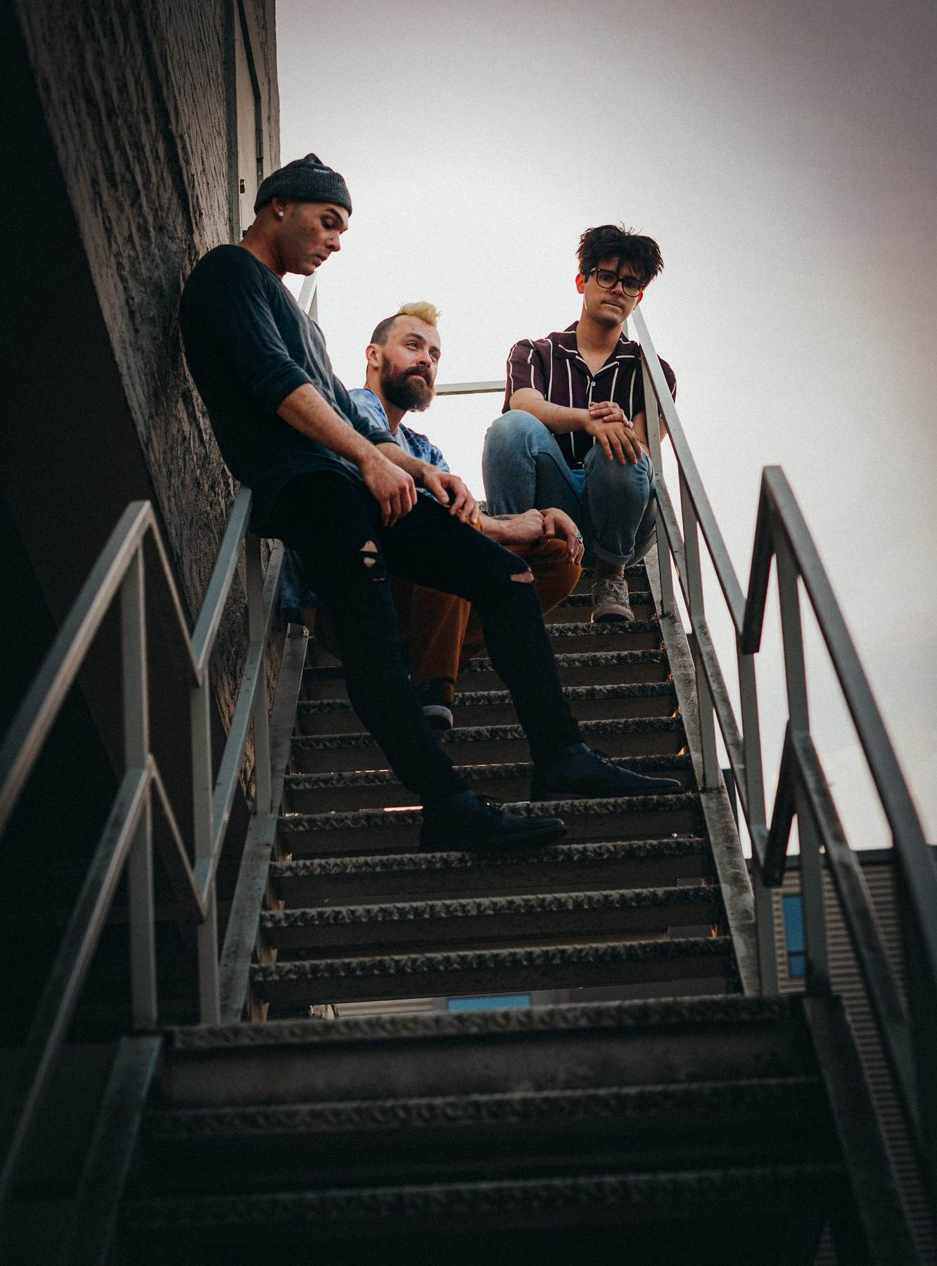 Band portrait on a rooftop staircase