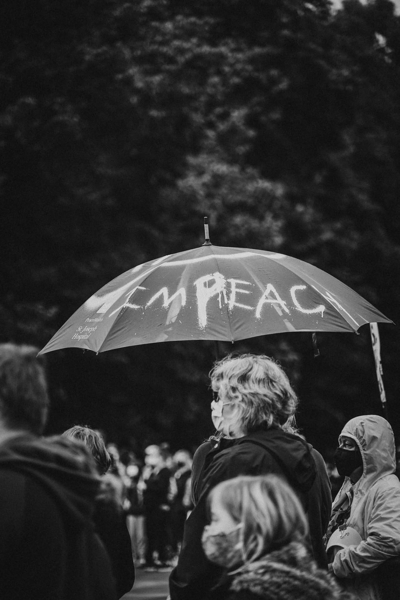 Protest umbrella reading impeach